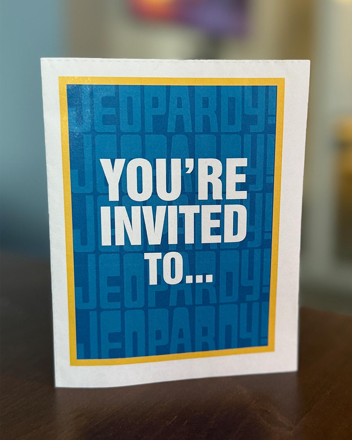 Jeopardy! themed invitation that reads " Your'e invited to..."